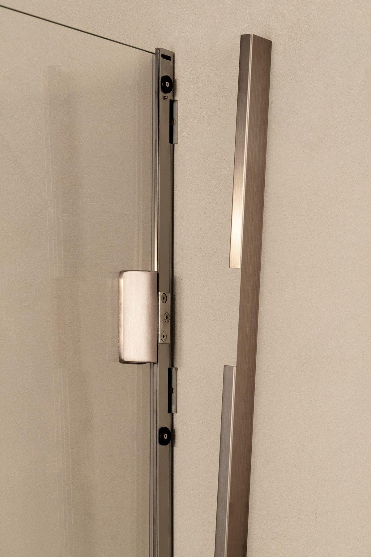 Wall attachment masked by a stainless steel cover